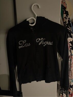 Y2K-style black zip-up hoodie